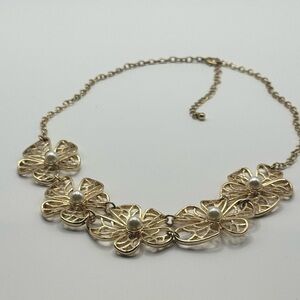 Golden Floral Statement Necklace with Textured Petals.